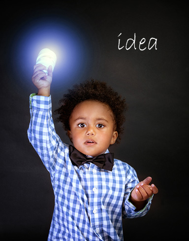 boy holding lightbulb idea